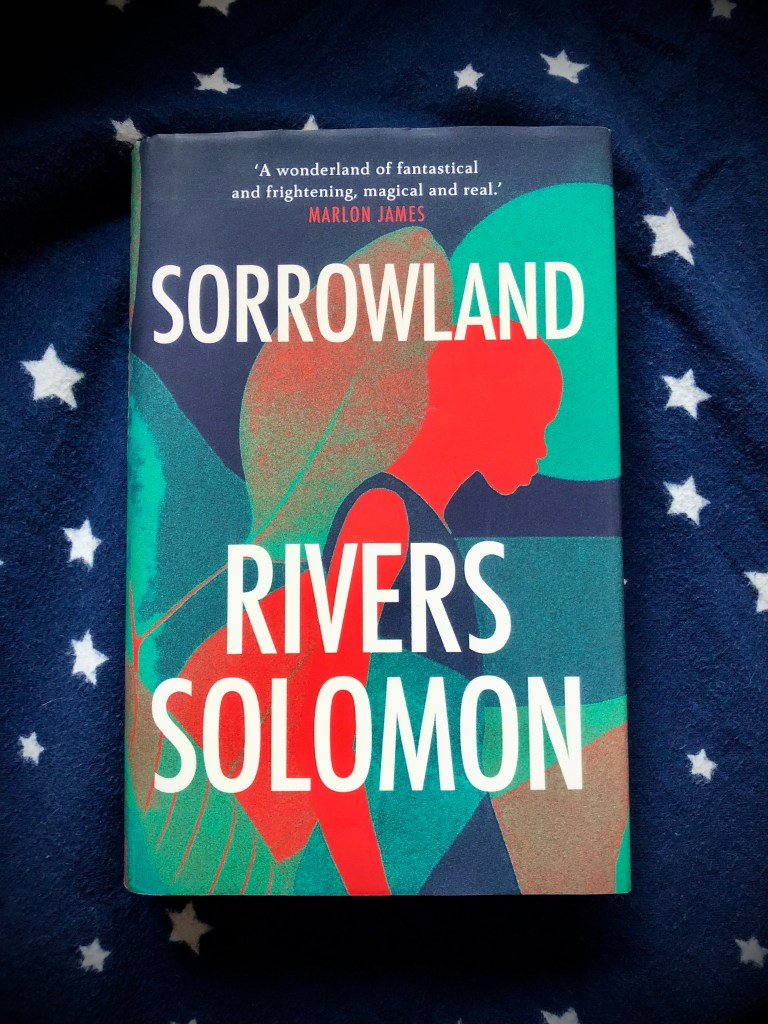 person in profile with leaves 